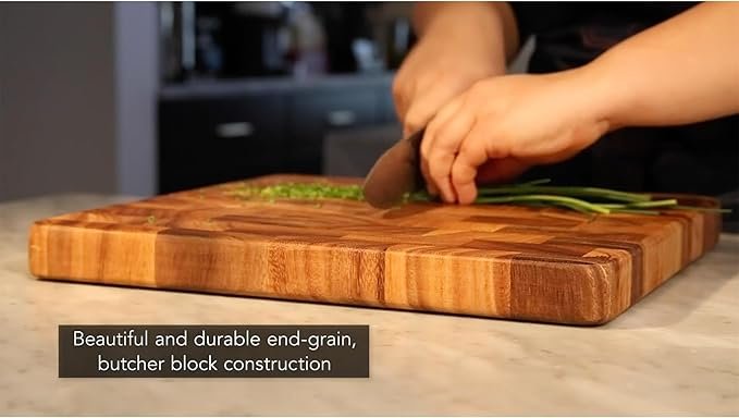 Photograph of someone chopping on the Ironwood Gourmet Acacia board, showing its durable end grain butcher block contrustruction